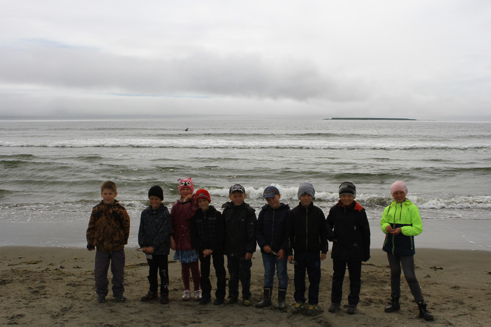 Children observed the grey whale. You can see its flipper above the water. Photo by the Commander Islands Reserve
