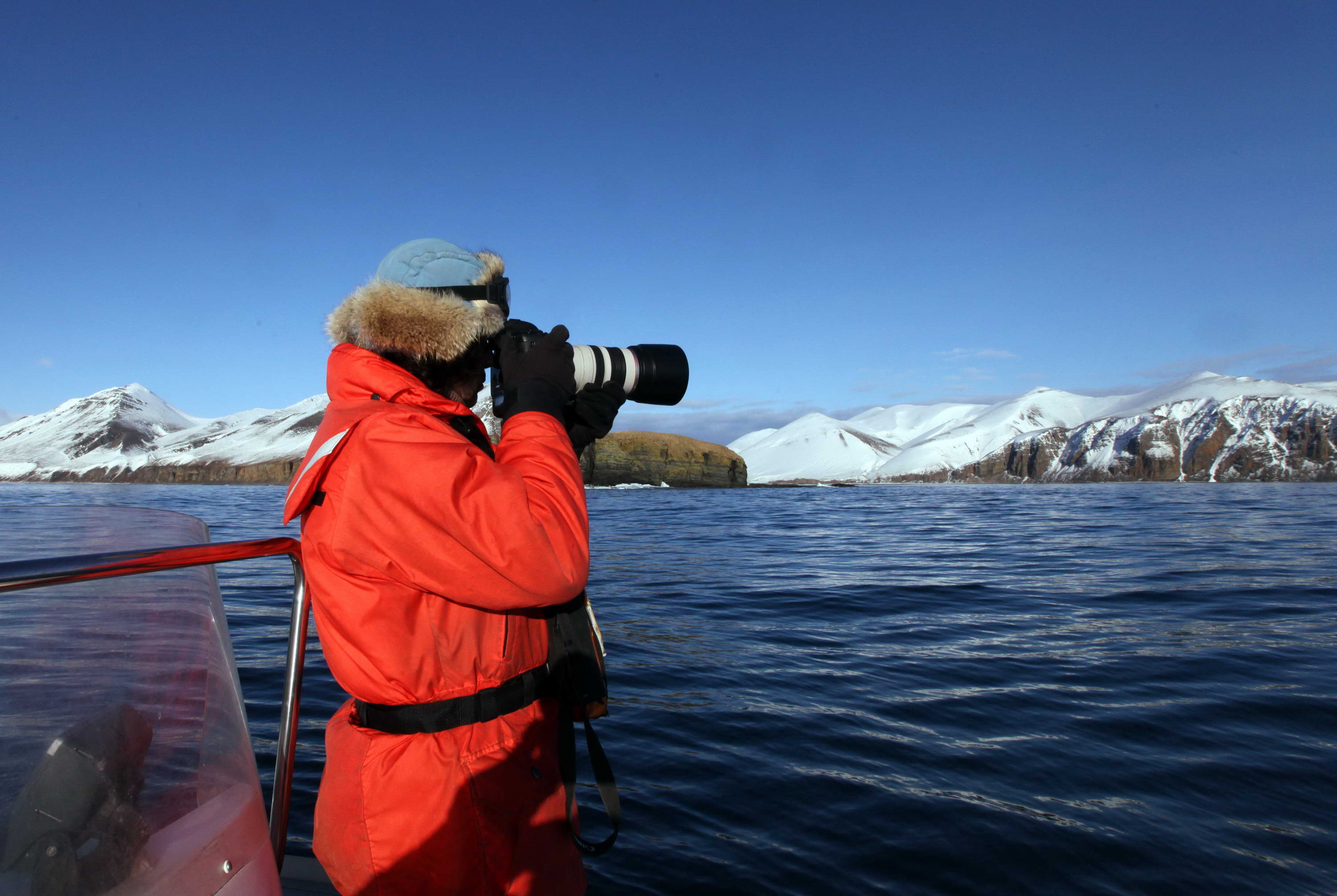 Evgeny Mamaev, PhD Biology and Deputy Director for Science in the Commander Islands Nature and Biosphere Reserve, takes photos for identification